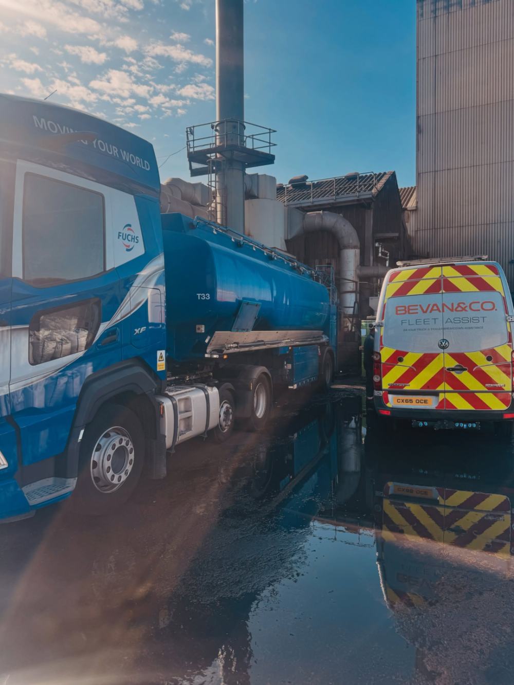 A blue tanker and the Bevan and Co. van at a job